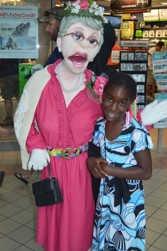 Arielle Williams gives a hug to one of the characters from “Puppet People”
